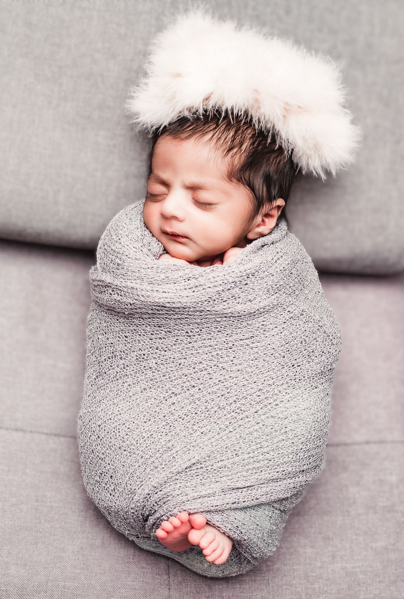 Real photograph of a newborn wrapped in a blanket